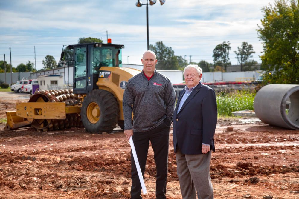 POP EXPANSION: Ozarks Coca-Cola/Dr Pepper Bottling, led by CEO Edwin “Cookie” Rice, at right, and President and Chief Operating Officer Bruce Long, is in the midst of dirt work on a $15 million, 400,000-square-foot warehouse expansion.